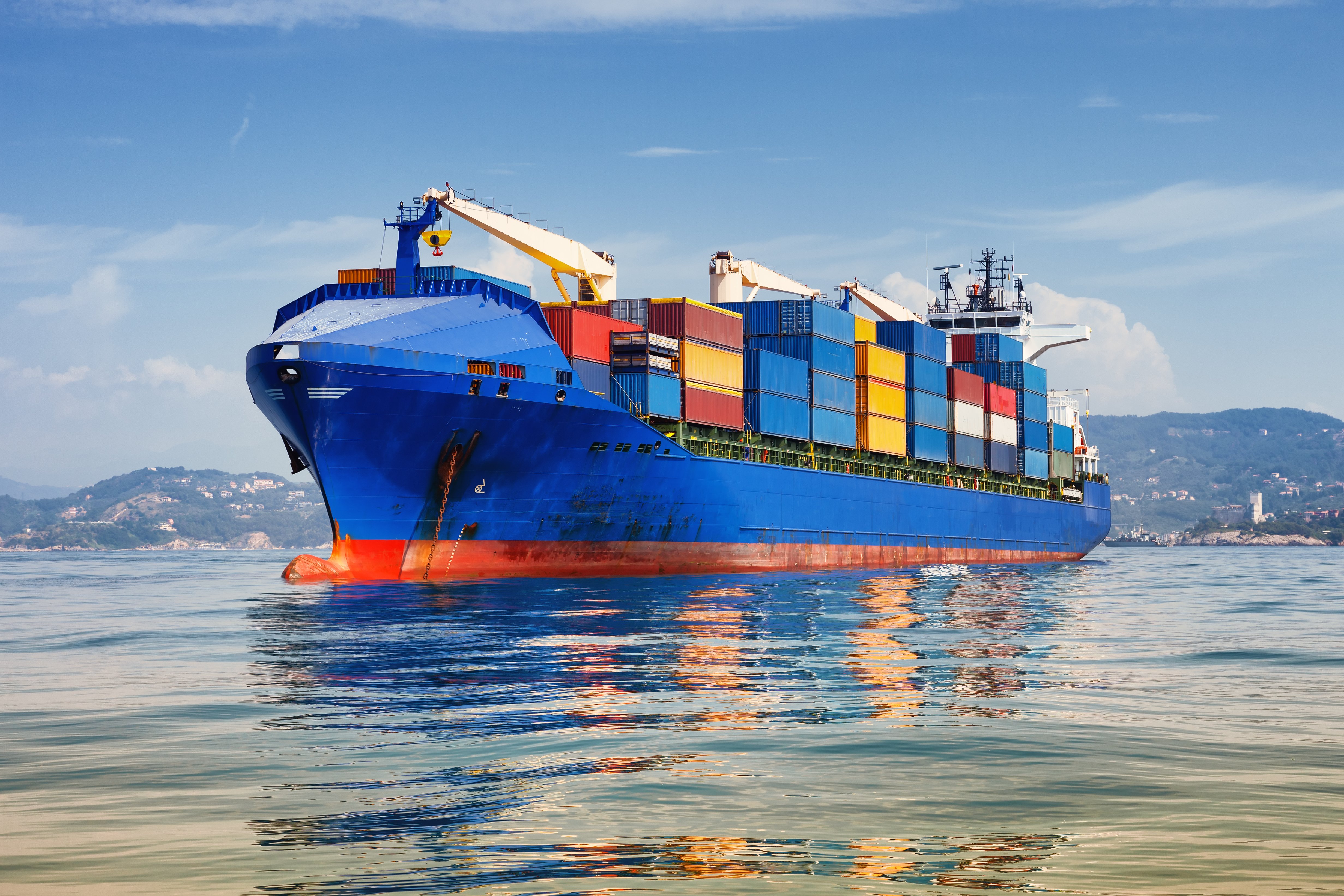 Blue cargo ship on water