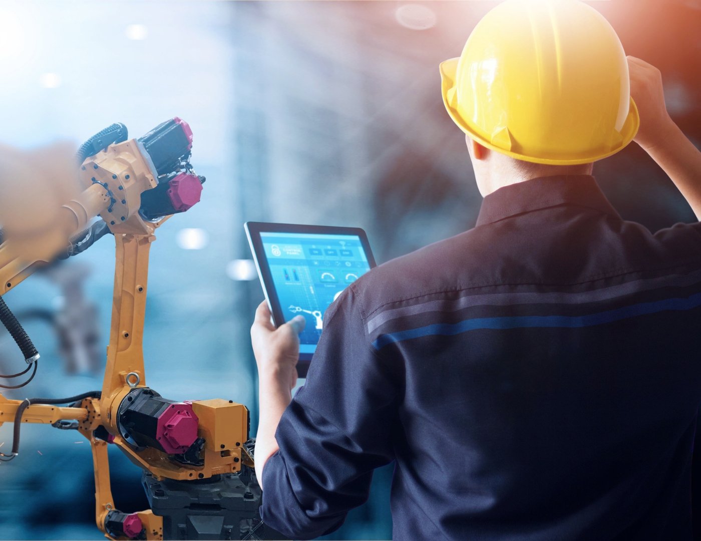 Factory Worker using IoT equipment and and a tablet
