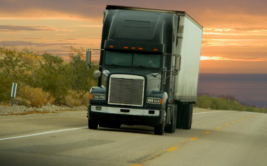 Truck on the road at sunset